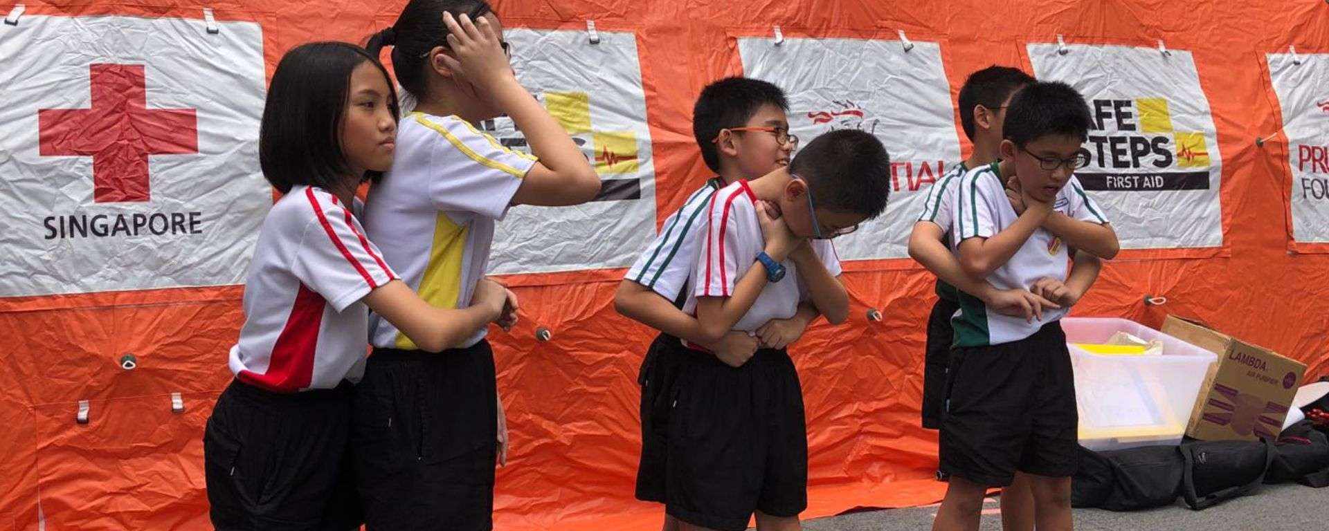 Children learning about first aid in class